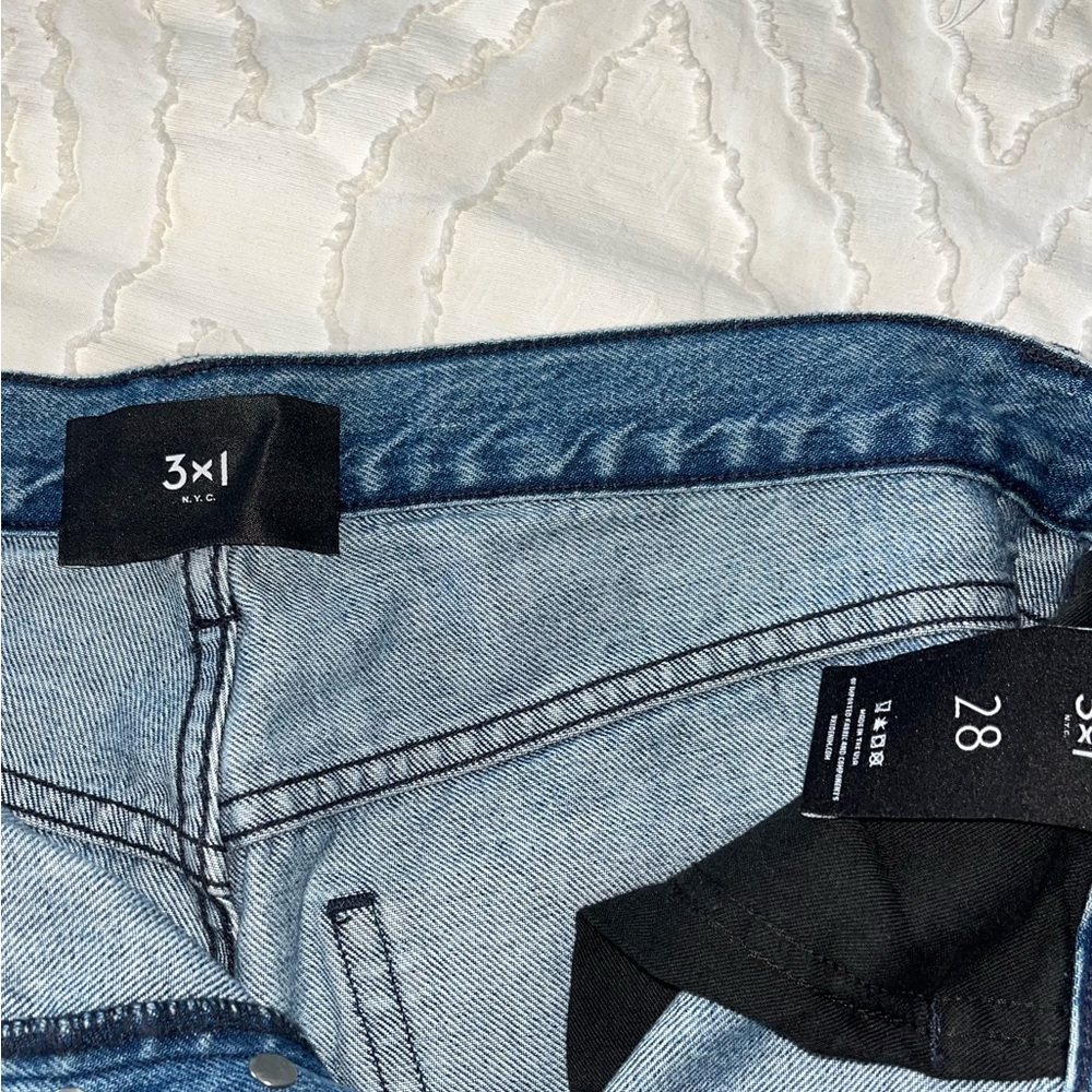 3X1 straight wide leg denim with fringe. Size 28